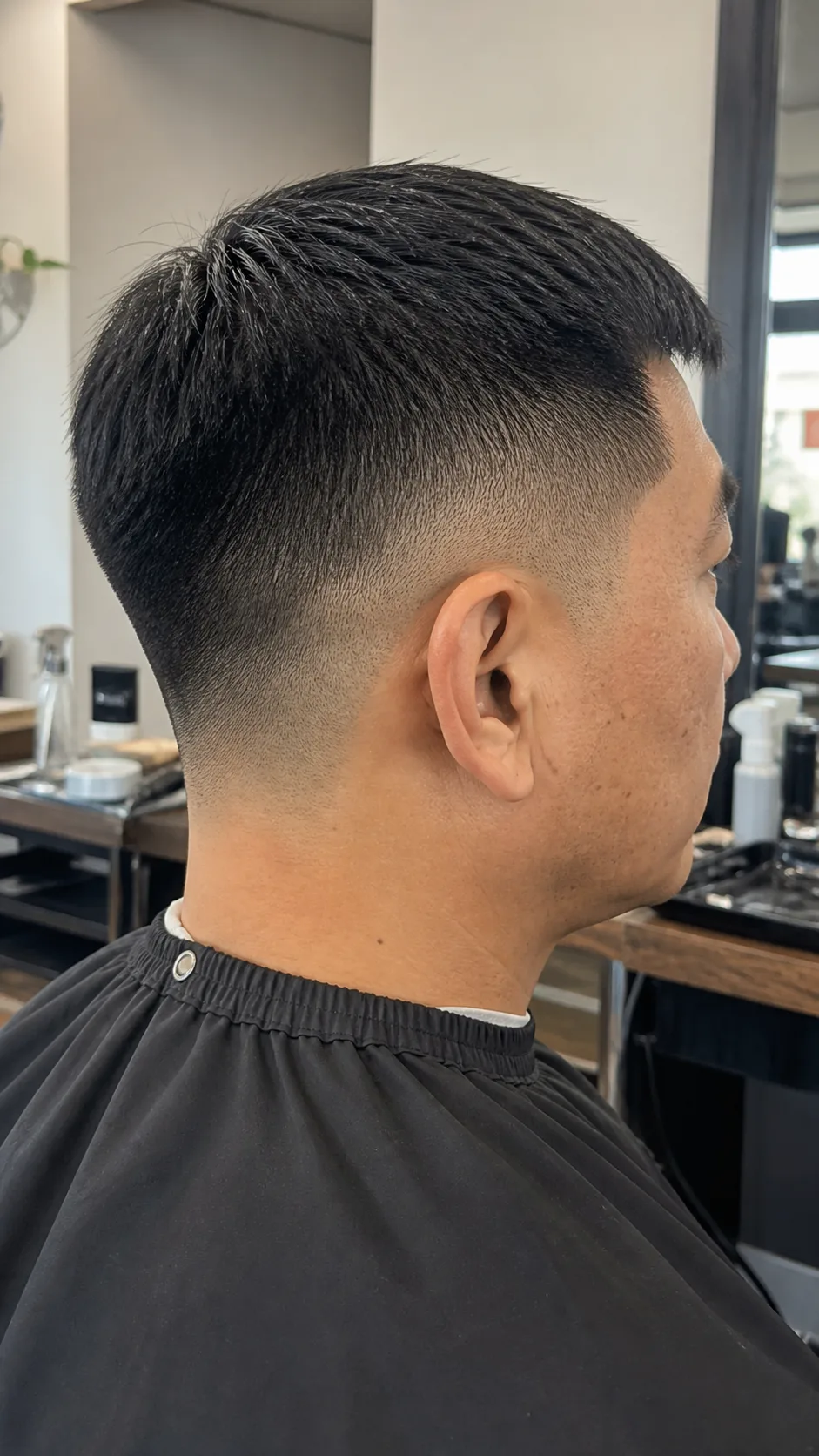Straight hair mid skin fade crop with a clean back neckline